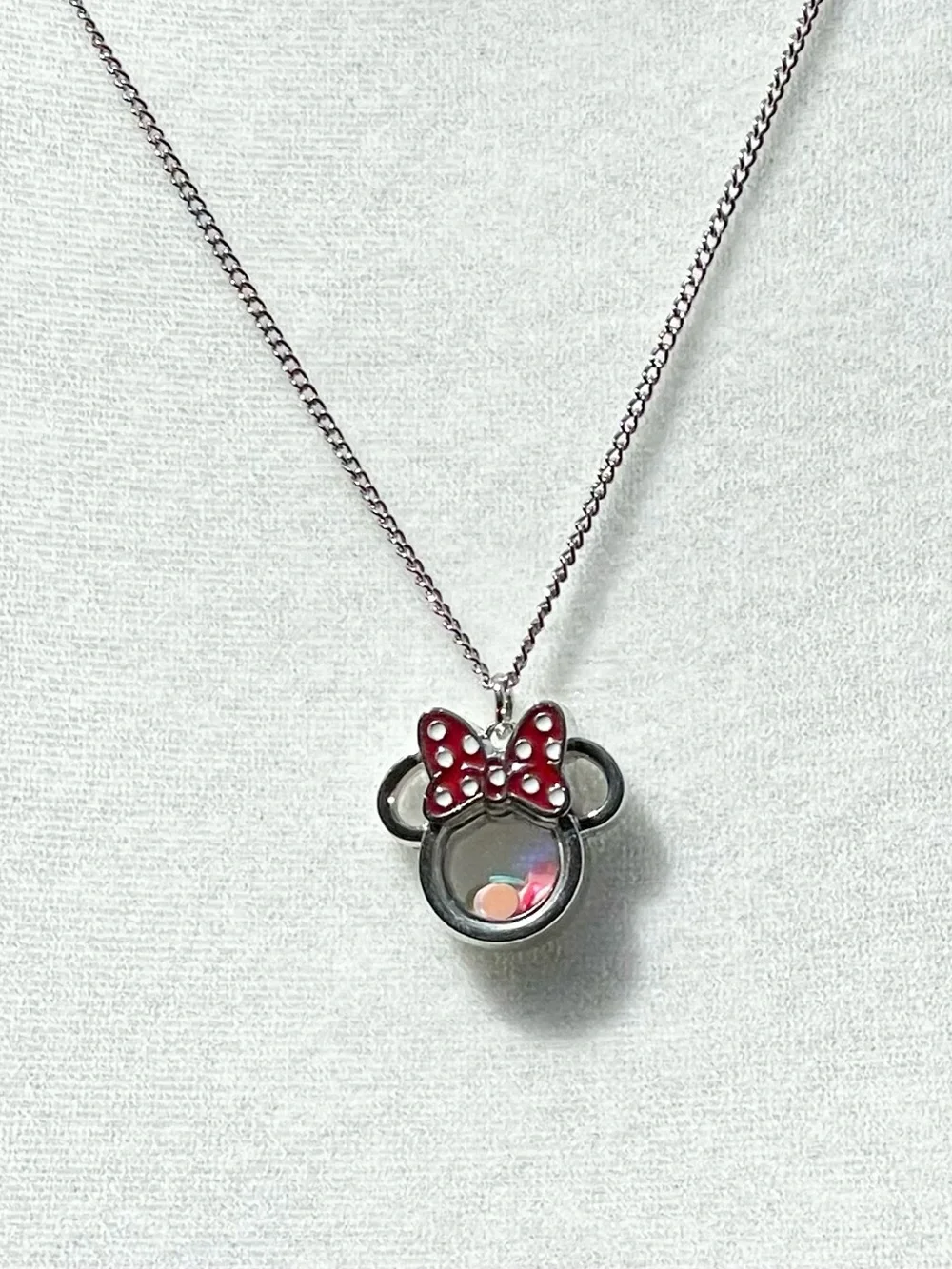 Minnie Mouse shaker charm on silver chain.